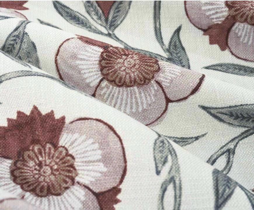 Dusty rose floral fabric with maroon detail designed for soft bedroom curtain enhancing cozy living space
