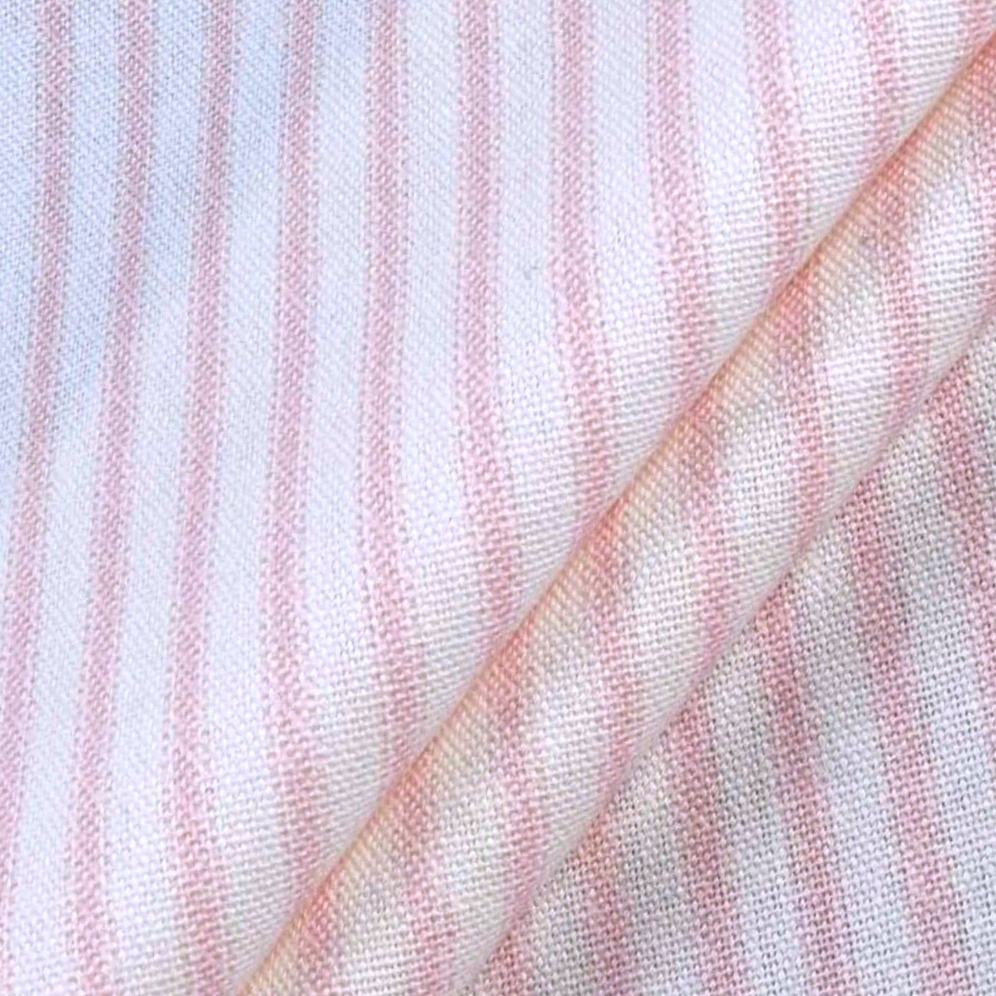 a close-up view of a fabric with horizontal pink and white stripes. The fabric appears to be folded or rolled, creating a visually interesting pattern.