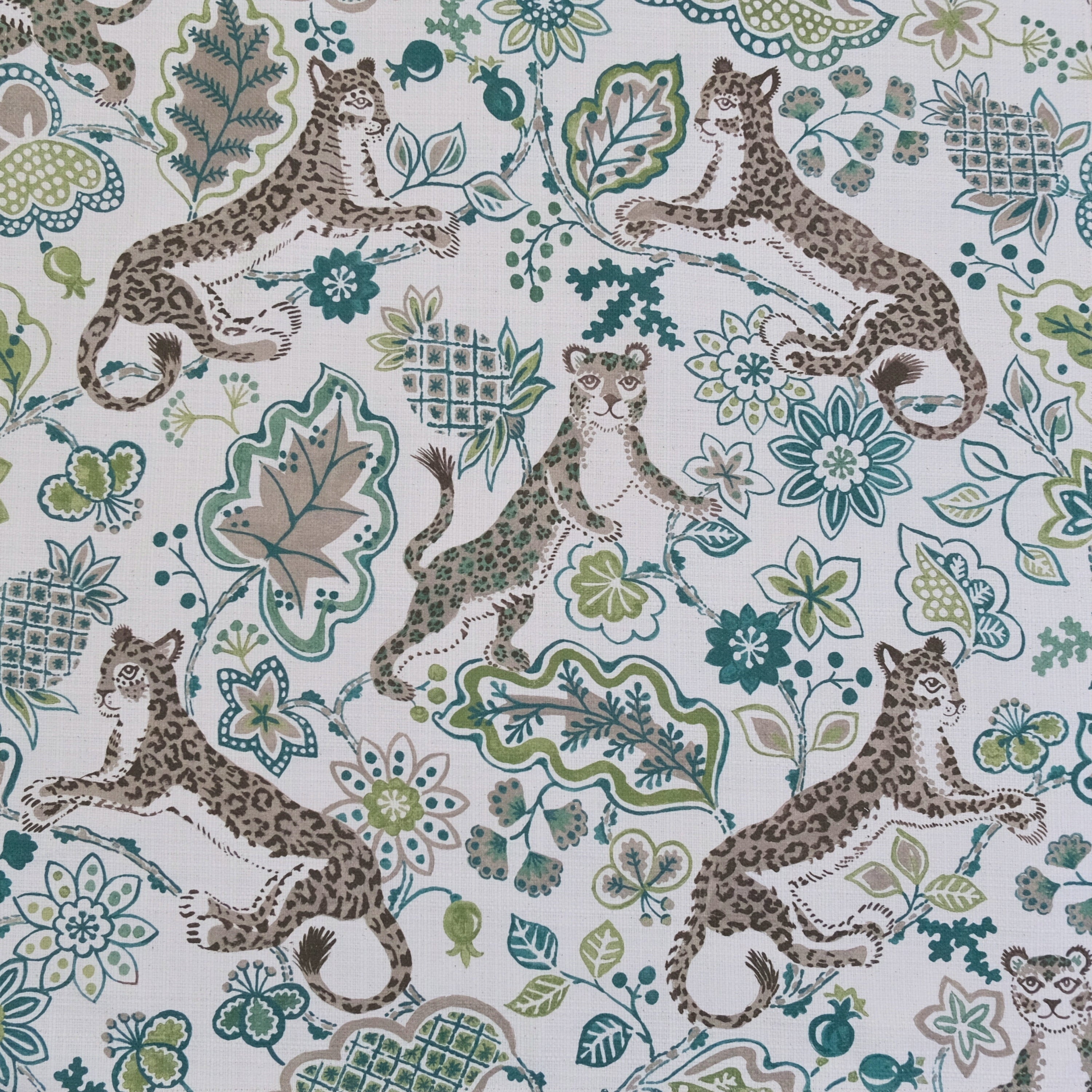 Green animal print floral fabric close up texture Interior decor fabric leopard floral design