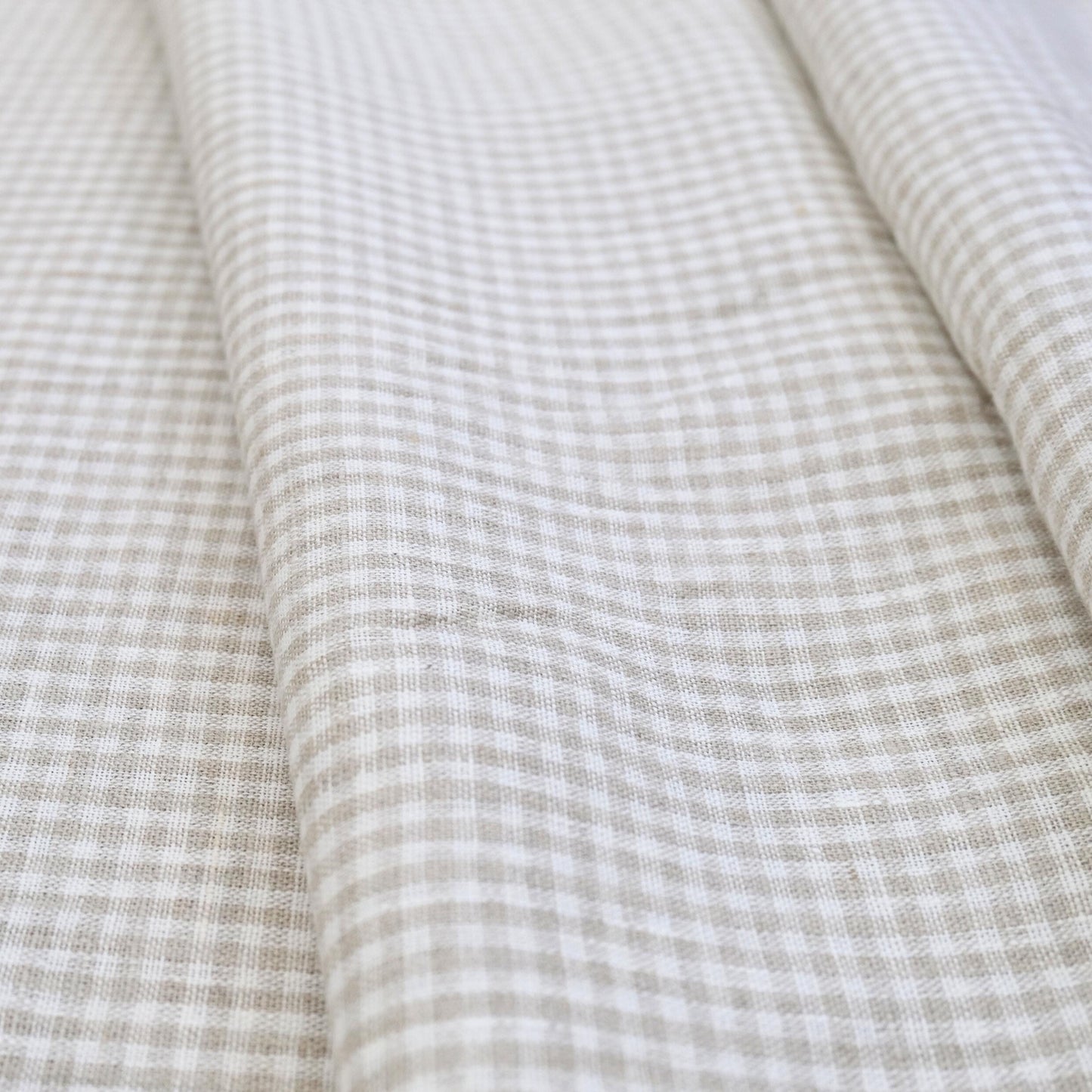 Classic beige gingham cotton fabric close-up pattern for quilting and home decor