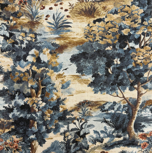 The image is a detailed and intricate fabric print featuring a lush, natural landscape with a variety of trees, bushes, and flowers in shades of blue, green, and brown. The print appears to be a collage of multiple images, creating a harmonious and visually appealing composition.