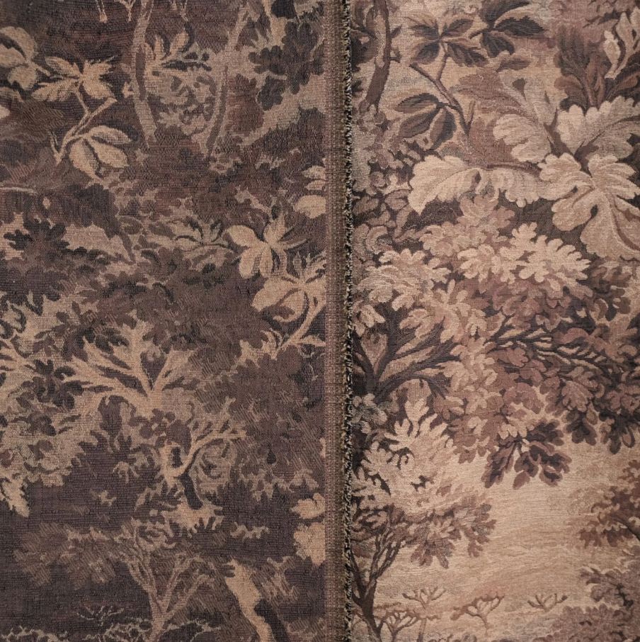 a close-up view of a fabric with a floral pattern, showcasing intricate details and textures.