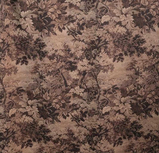 The image is a close-up of a fabric with a detailed, intricate floral pattern. The pattern consists of various shades of brown and beige, creating a lush, natural-looking design. The fabric appears to be a type of wallpaper or textile, with the intricate design and texture suggesting it could be used for decorative purposes or as a home textile.