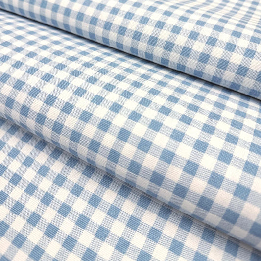 a close-up view of a fabric with a blue and white checkered pattern.