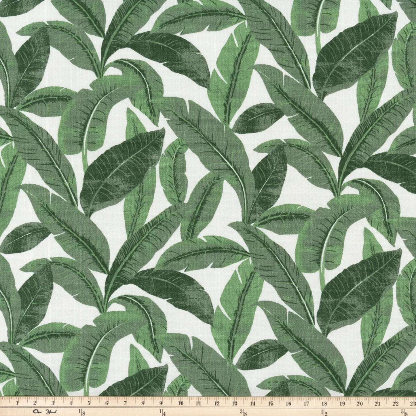 a green and white wallpaper with leaves on it