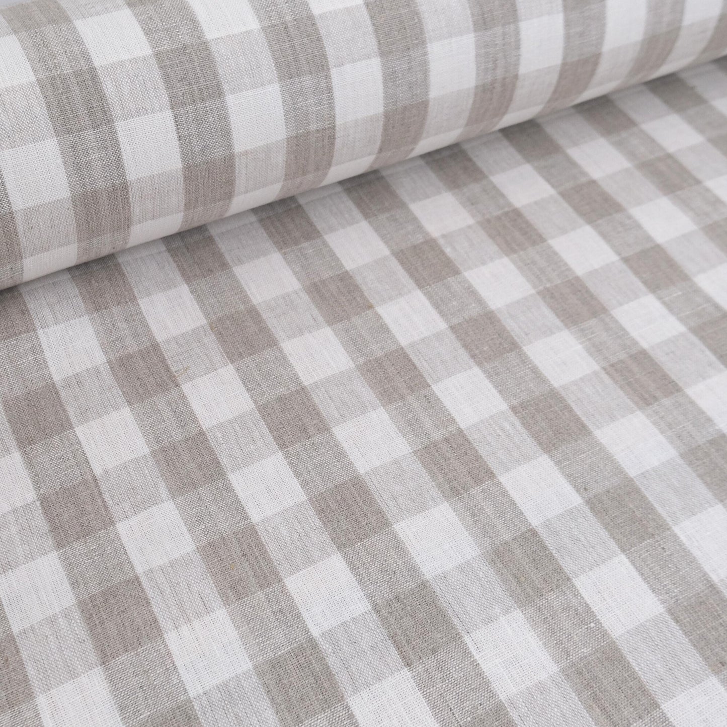 Neutral checkered linen fabric draped for curtain sewing