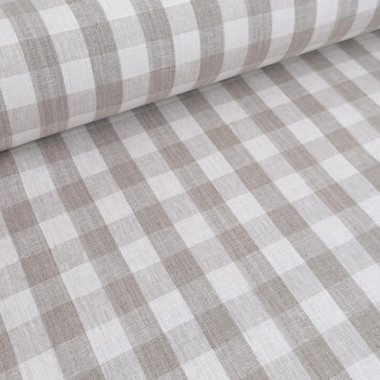 Neutral checkered linen fabric draped for curtain sewing