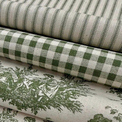 a close-up view of a stack of fabric rolls with a green and white checkered pattern.