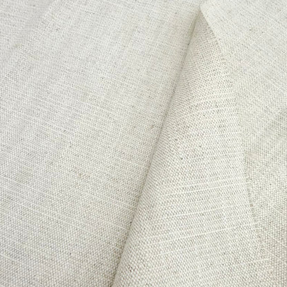 Close-up of oatmeal-colored textured linen material highlighting the natural organic fiber weave.