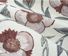 Dusty rose floral fabric with maroon detail designed for soft bedroom curtain enhancing cozy living space
