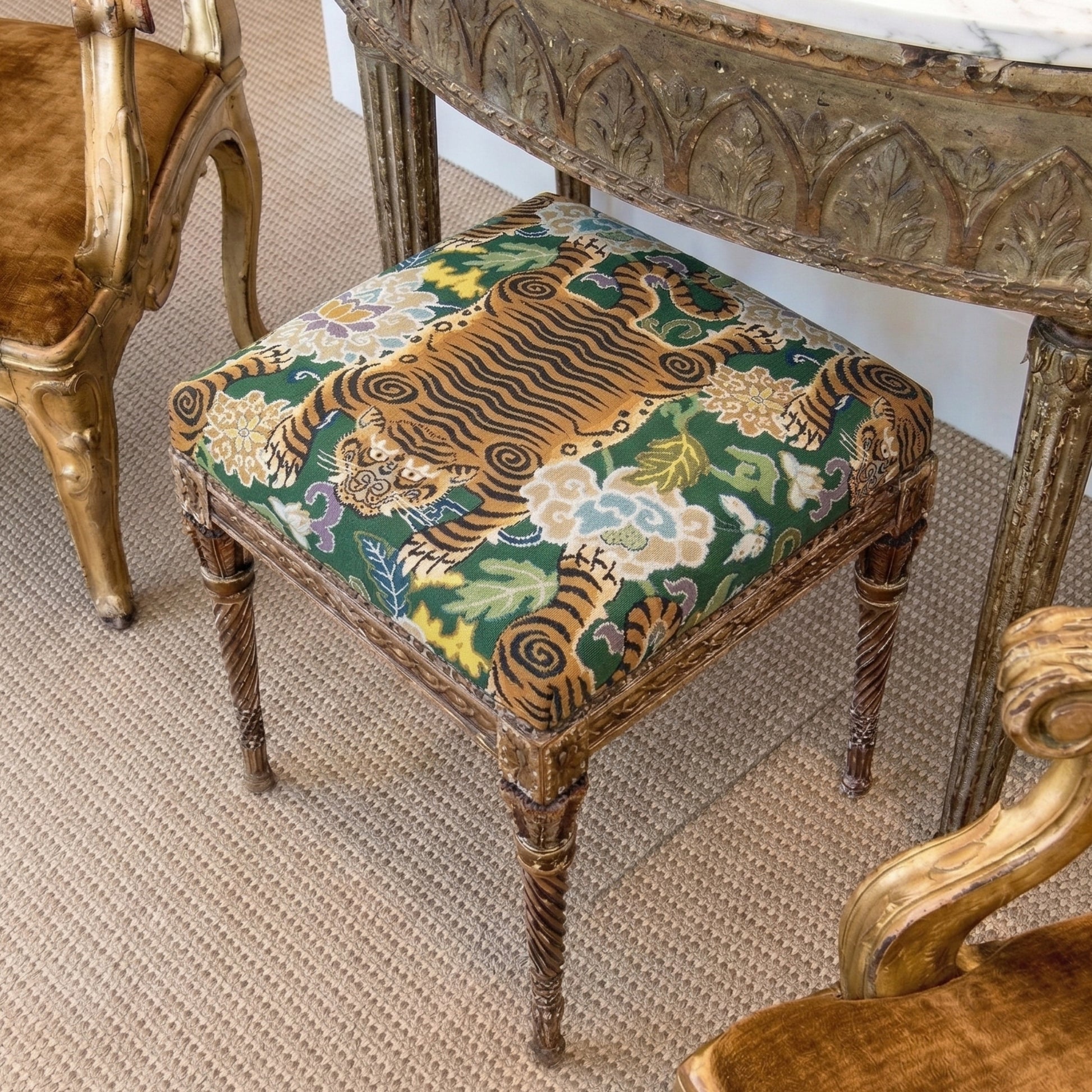 a decorative chair with a vibrant tiger print cushion, placed on a carpeted floor.