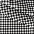 a close-up view of a fabric with a distinctive black and white checkered pattern.