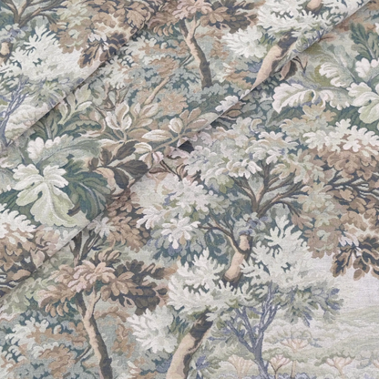 a close-up view of a fabric with a detailed floral pattern. The pattern consists of various shades of green, brown, and white, creating a lush and vibrant appearance. The fabric appears to be a type of textile, possibly a piece of clothing or a decorative item. The image does not contain any text or other discernible objects, and the focus is solely on the intricate floral design.