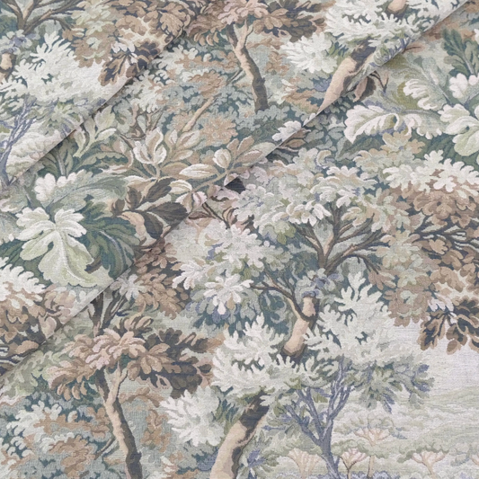 a close-up view of a fabric with a detailed floral pattern. The pattern consists of various shades of green, brown, and white, creating a lush and vibrant appearance. The fabric appears to be a type of textile, possibly a piece of clothing or a decorative item. The image does not contain any text or other discernible objects, and the focus is solely on the intricate floral design.