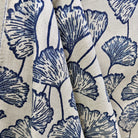 Blue and cream ginkgo leaf fabric draped to show large scale botanical pattern and texture