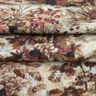 a close-up view of a fabric with a floral pattern, showcasing the intricate details and textures of the design.
