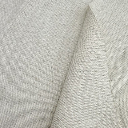 a close-up view of a fabric with a textured, woven appearance. The fabric appears to be made of a light-colored material, possibly linen or a similar type of textile. The image does not contain any text or other discernible objects or actions.