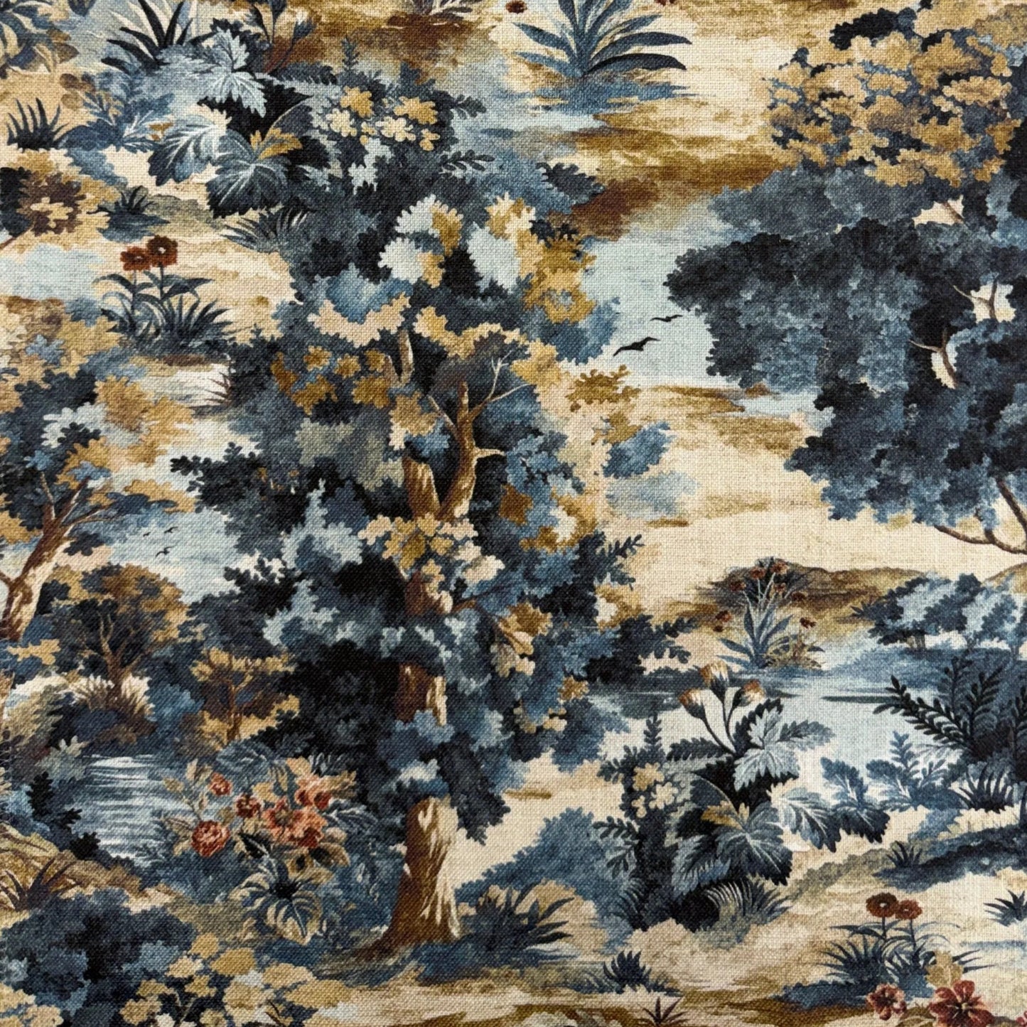 The image is a detailed tapestry or fabric with a lush, colorful landscape featuring a variety of trees, flowers, and foliage in shades of blue, green, and brown.