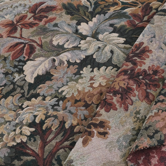 Close-up of verdure foliage tapestry upholstery fabric in Woodrose tones showing scenic woven leaves and branches, heavyweight jacquard material ideal for sofa upholstery, chair covers, antique style drapery, slipcovers, pillows, and vintage decorative home textiles.