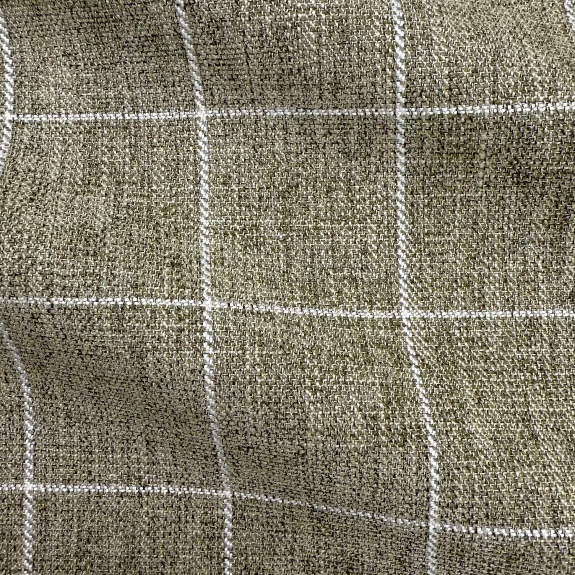 a close-up view of a textured fabric with a grid-like pattern of white lines.