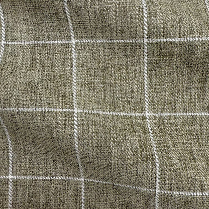 a close-up view of a textured fabric with a grid-like pattern of white lines.