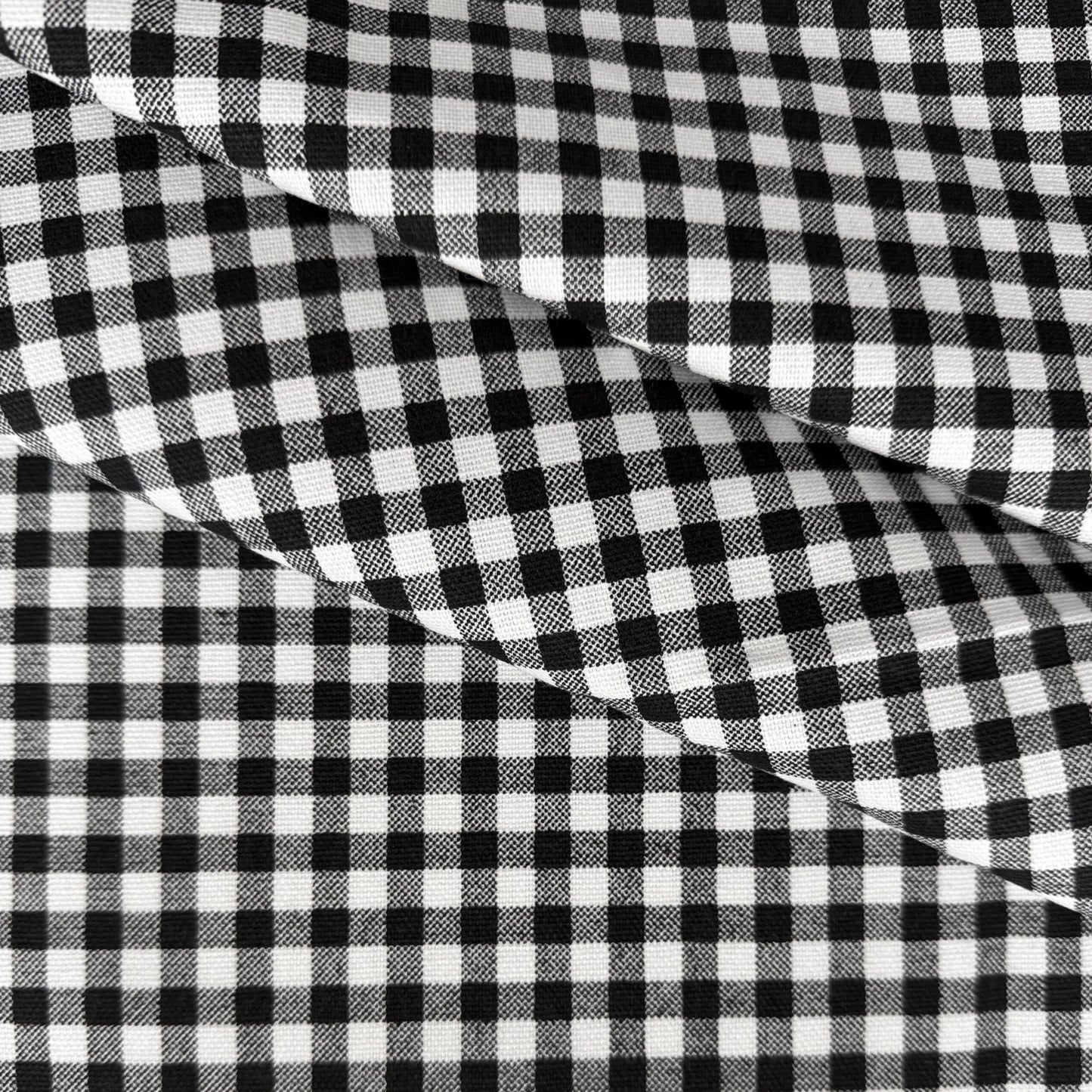 a close-up view of a fabric with a distinctive black and white checkered pattern.