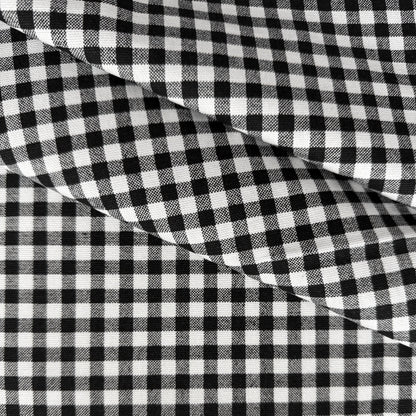 a close-up view of a fabric with a distinctive black and white checkered pattern.