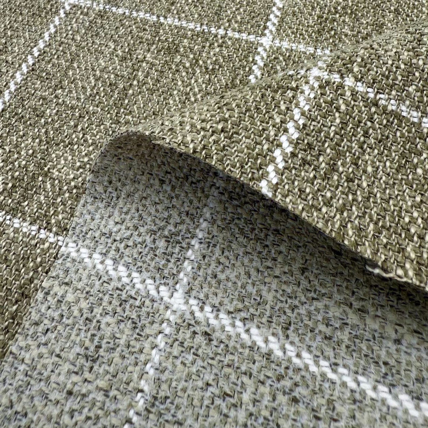 a close-up view of a woven fabric with a checkered pattern, featuring a mix of green and gray colors.