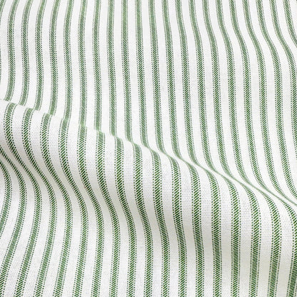 a close-up view of a fabric with a striped pattern in shades of green and white. The fabric appears to be made of a woven material, with the green stripes standing out against the white background.