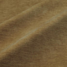 a close-up view of a textured fabric, possibly a piece of clothing or a textile. The fabric appears to be brown in color and has a criss-cross pattern, giving it a somewhat wrinkled appearance.