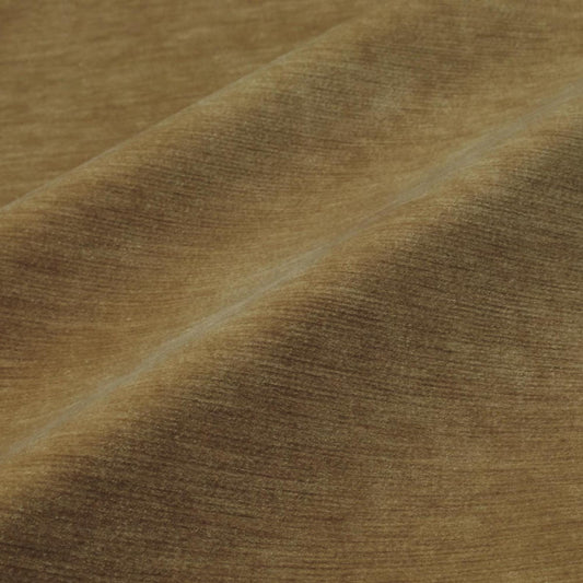 a close-up view of a textured fabric, possibly a piece of clothing or a textile. The fabric appears to be brown in color and has a criss-cross pattern, giving it a somewhat wrinkled appearance.