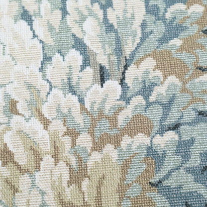 The image is a close-up of a fabric with a floral pattern, featuring a mix of light and dark green and beige colors.