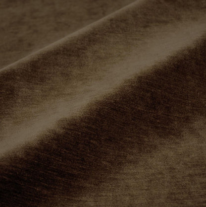 a close-up view of a brown fabric, possibly velvet, with a textured and wrinkled appearance.