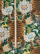 Scale reference with a ruler measuring the height and repeat of the tiger pattern on the emerald green upholstery fabric.