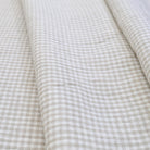 Classic beige gingham cotton fabric close-up pattern for quilting and home decor