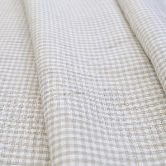 Classic beige gingham cotton fabric close-up pattern for quilting and home decor