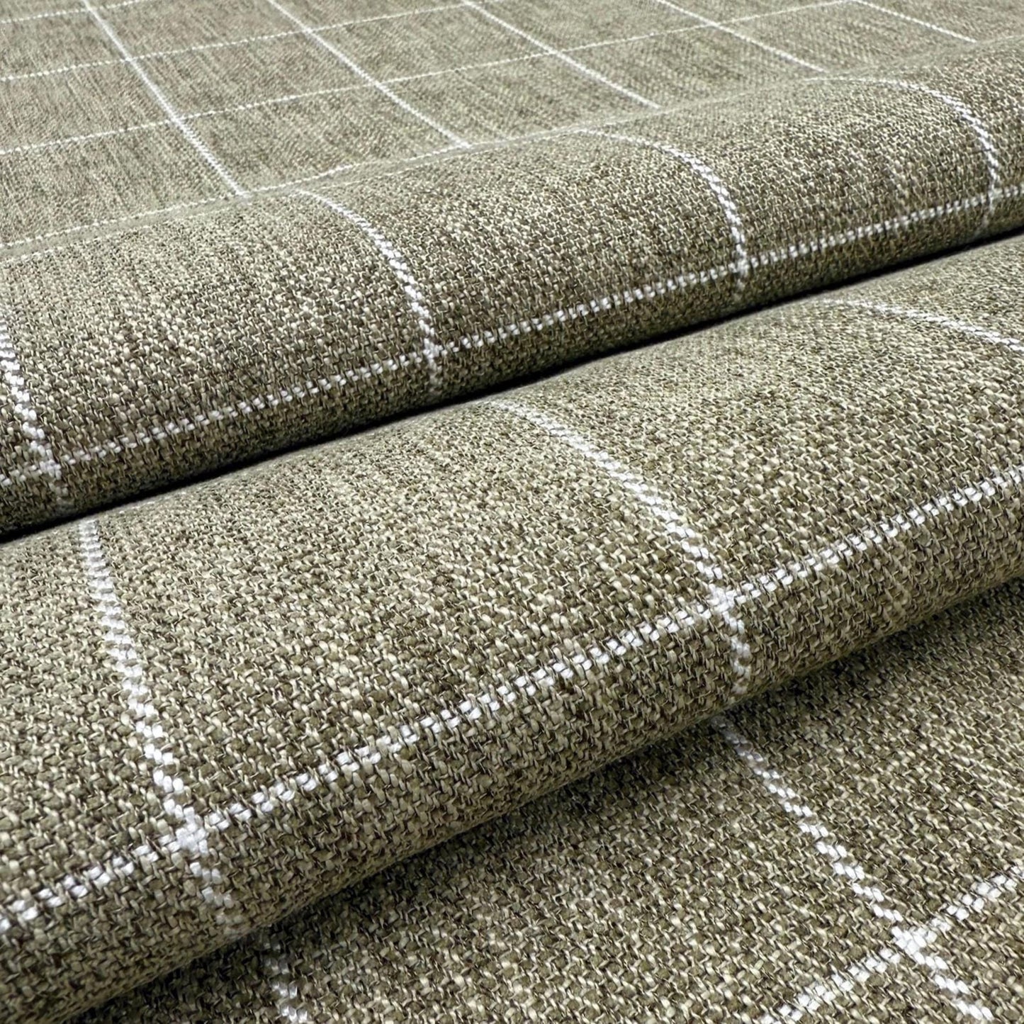 a close-up view of a textured fabric with a checkered pattern, featuring a repeating diagonal grid of white lines.
