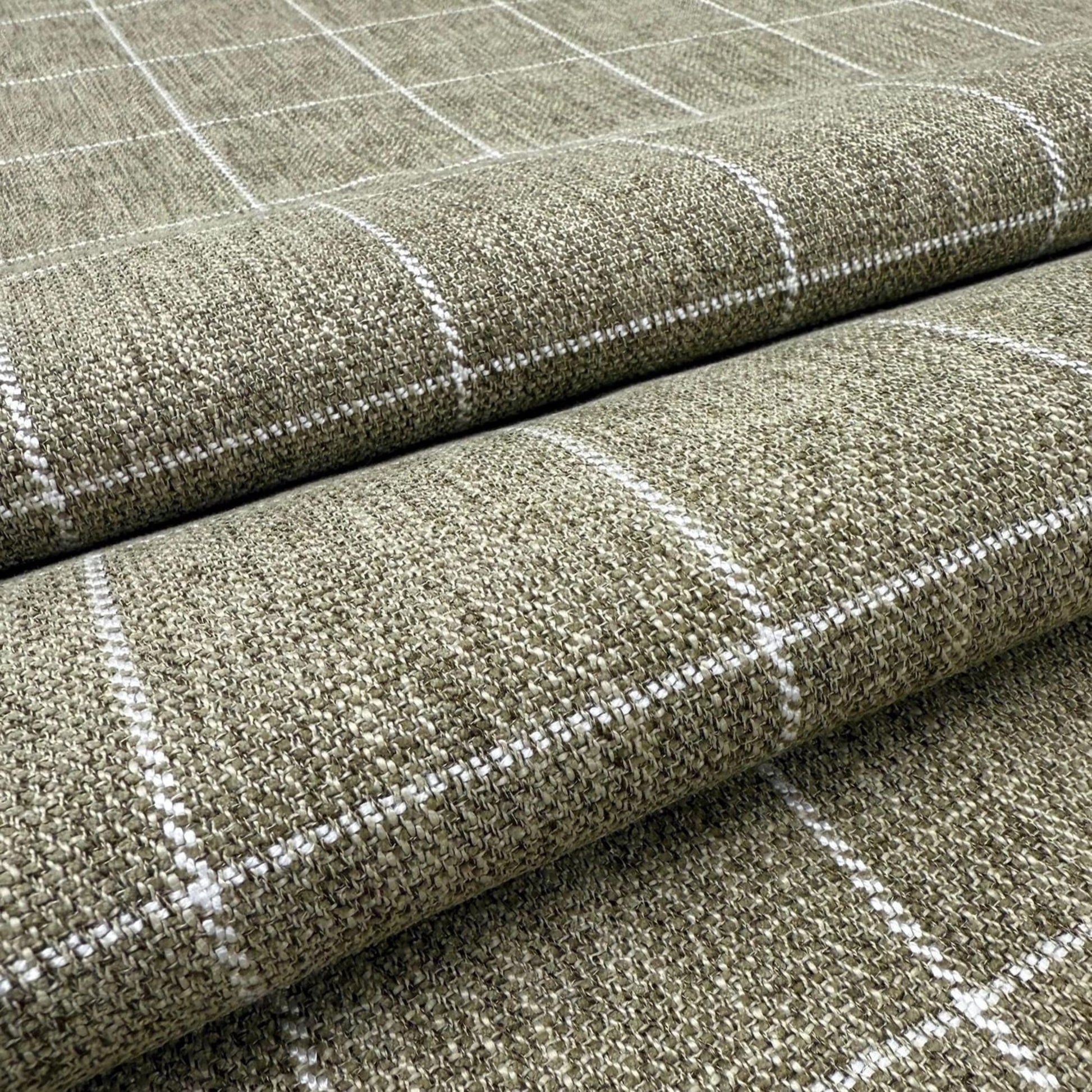 a close-up view of a textured fabric with a checkered pattern, featuring a repeating diagonal grid of white lines.