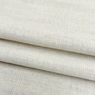 Soft drapes of natural cream slub linen fabric perfect for custom curtains and home decor.