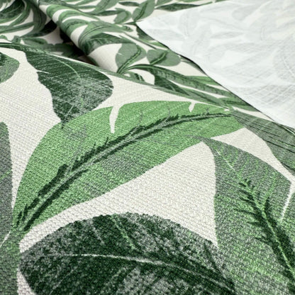 a close-up view of a fabric with a repeating pattern of green leaves. The leaves are arranged in a way that creates a textured and visually appealing design.