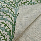 Green leaf pattern fabric close up texture