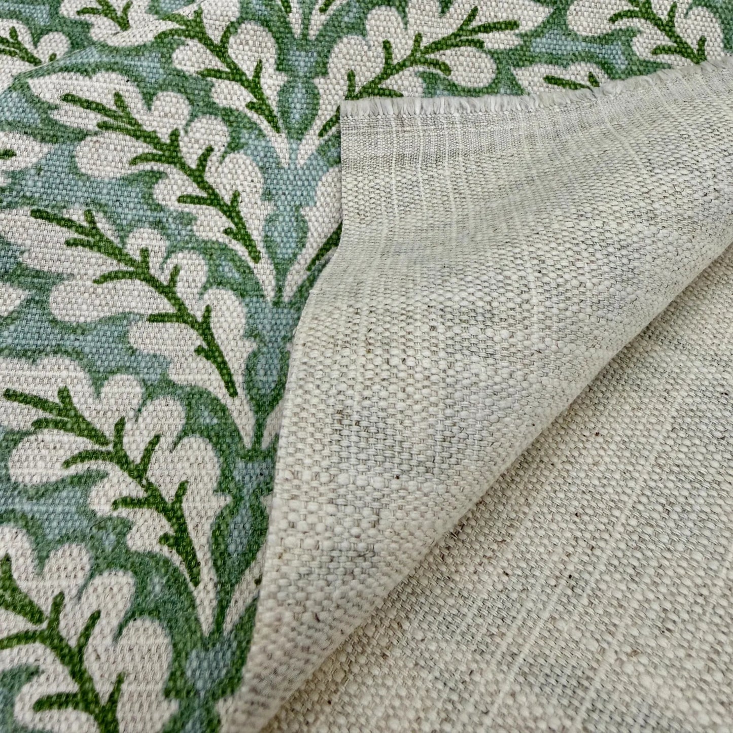 Green leaf pattern fabric close up texture