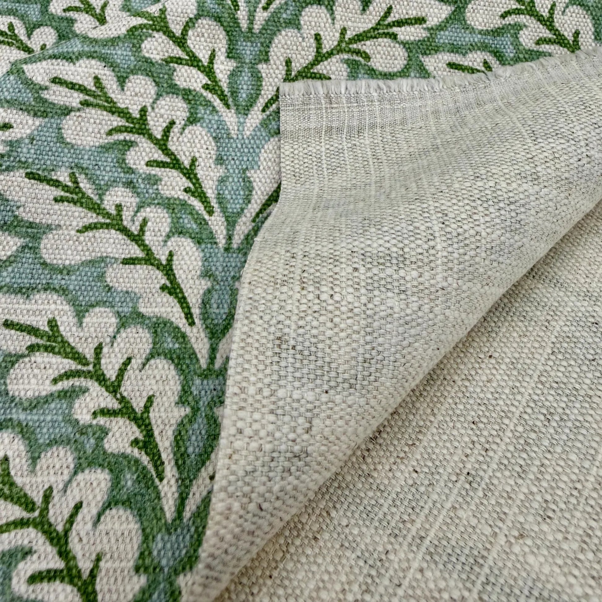 Green leaf pattern fabric close up texture