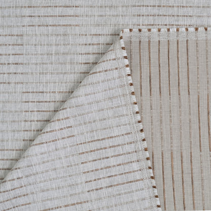 a close-up view of a fabric with a striped pattern, featuring a diagonal line running across it. The fabric appears to be made of a light-colored material, possibly linen or cotton, with a textured appearance.