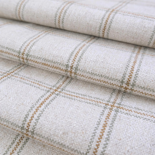 May include: Close-up of a woven fabric with a plaid pattern. The fabric is primarily off-white with intersecting lines in shades of brown and gray, creating a grid-like design. The texture appears slightly uneven, suggesting a natural fiber material.