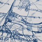 The image is a close-up of a textured fabric with a blue and white abstract pattern. The pattern consists of various lines, curves, and shapes, creating a visually interesting and dynamic design.