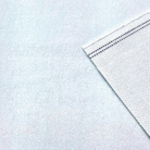 a close-up view of a white fabric with a black stripe running across it.