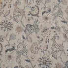 Beige fabric with a repeating pattern of stylized animals and floral elements. The design features a deer, tiger, and birds among ornate flowers and foliage. The color palette includes shades of brown, beige, and hints of green, creating a vintage, textured look.