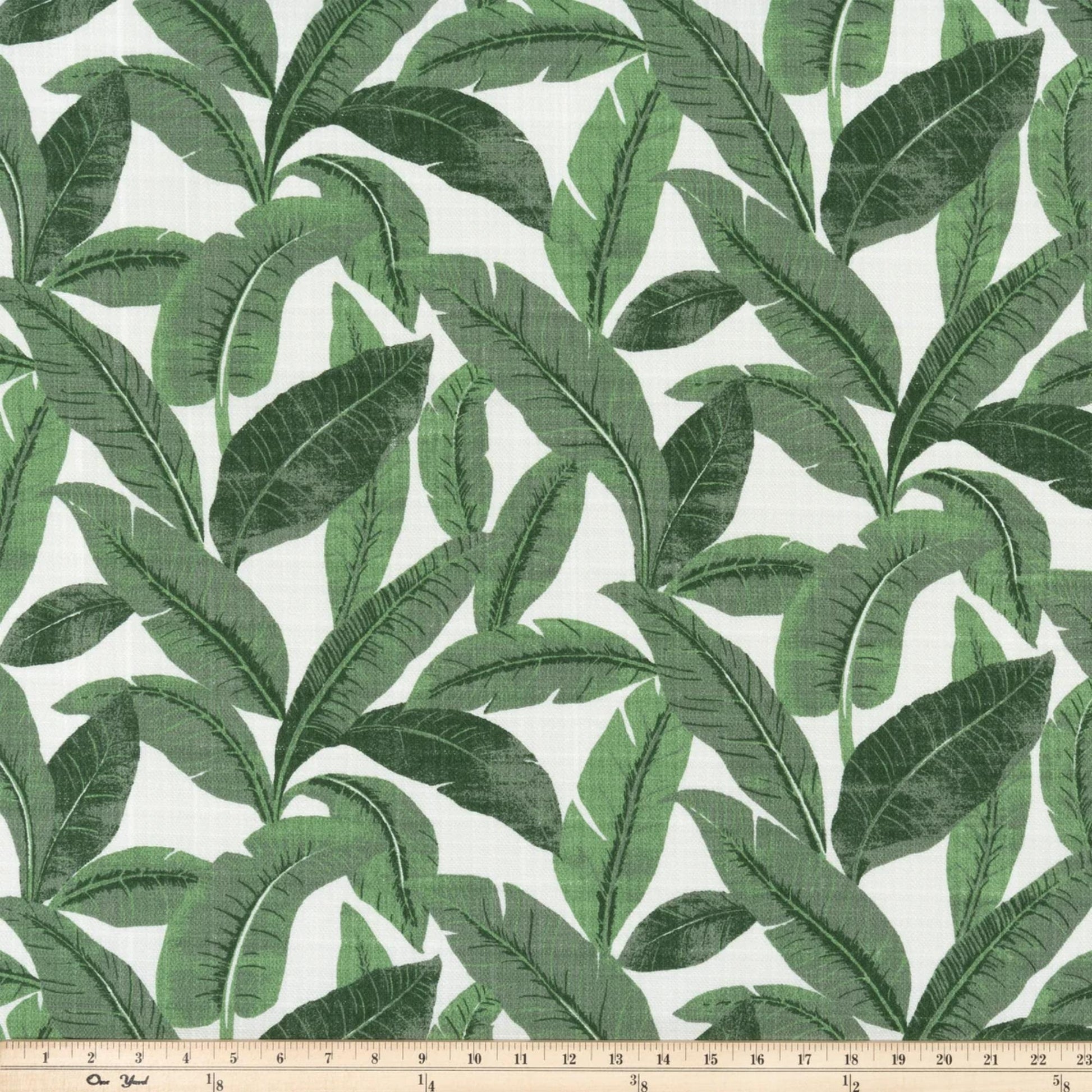 a green and white wallpaper with leaves on it