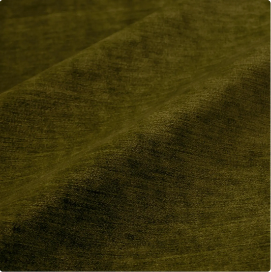 a close-up view of a textured fabric, possibly a piece of clothing or a textile. The fabric appears to be a dark green or olive-colored material, with a slightly wrinkled and folded appearance.